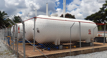 four large gas containers